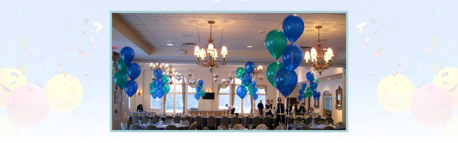 Banquet hall with blue and green balloons, set tables, chandeliers, and staff preparing for an event.